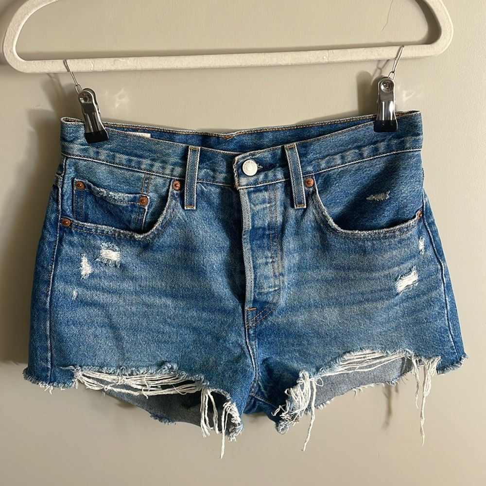 Levi’s 501 cut off shorts, light, blue, slight, distressed on pockets